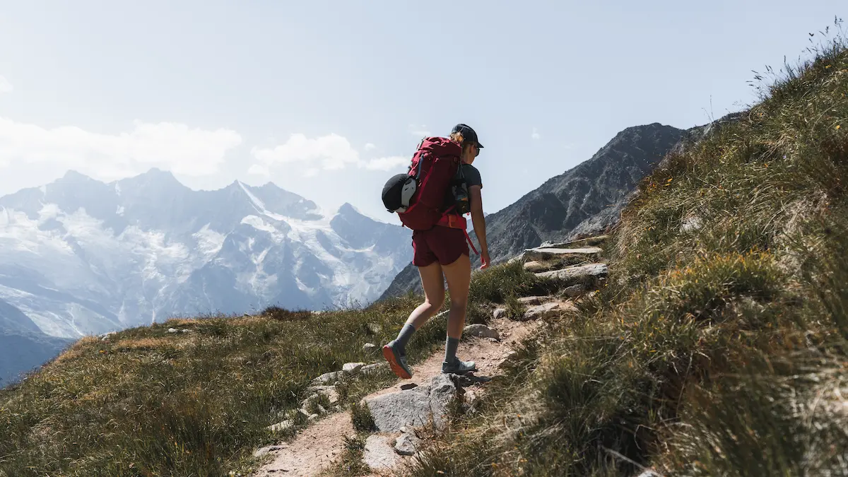 Hiker with a backpack on a mountain trail near Bozeman, Montana